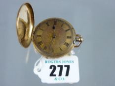 An eighteen carat gold encased lady's fob watch with finely patterned enamel front and back (no
