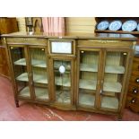 A good quality walnut breakfront French style cabinet with central bevelled edge glass eleven pane
