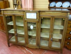 A good quality walnut breakfront French style cabinet with central bevelled edge glass eleven pane