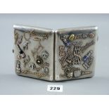 A Russian silver cigarette case with fourteen applied gold and silver signatures and monograms,