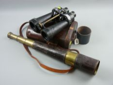 A pair of World War II Barr & Stroud naval binoculars in a leather case along with a brass and