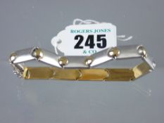 A white metal (marked fourteen carat) satin effect bracelet with yellow metal ball decoration, 13.