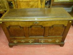 A well coloured 18th Century oak dower chest having three shaped and fielded front panels with two