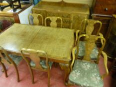 A nice quality 20th Century walnut dining suite comprising of a railback sideboard, extending dining