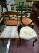 A pair of mahogany side chairs with pierced central splat and carved top rail, a balloon back side