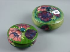 Two Moorcroft pottery 'Anemone' powder pot and covers, green/blue ground bodies, 14 cms diameter the