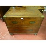 A compact mahogany two drawer campaign chest, brass bound with brass corners and with inset brass