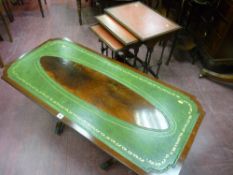 A set of three reproduction leather topped side tables and a twin pedestal mahogany coffee table