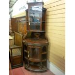 An excellent high Victorian display corner cabinet by Lamb of Manchester, having a single central