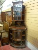 An excellent high Victorian display corner cabinet by Lamb of Manchester, having a single central