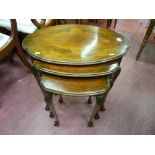 A set of three wavy edged top walnut side tables with carved knees, slender supports on ball and