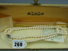 A twin strand necklace of Ciro pearls in original box and having an oval white metal clasp with