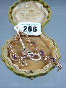 A nine carat gold bracelet of seven attractive oval links, each with an oval cut amethyst with