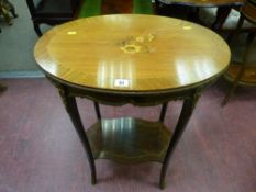 A French Kingwood style side table with gilt metal mounts and inlaid oval top and shaped rosewood