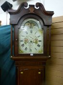 An early 19th Century oak and mahogany crossbanded longcase clock with broken swan neck pediment and
