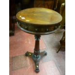 A Victorian rosewood capstan topped lidded work table with turned segmented support column on a