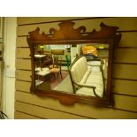 A Bevan Funnell reproduction walnut framed mirror in the Georgian style, 61 x 69 cms