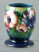 A Moorcroft pottery 'Anemone' wide footed vase of ovoid form, incised 'W Moorcroft' with impressed