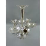 An all silver epergne having a pierced upturned trumpet base with plain tapering centre trumpet