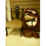 A Victorian mahogany swing toilet mirror with carved frame on a shaped stepped base with front