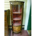 A reproduction French style Kingwood and brass embellished corner cabinet with tulip wood inlay to