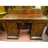 A 19th Century mahogany twin pedestal sideboard with raised back panel, inverted breakfront top with