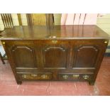 A well patinated 18th Century oak Lancashire style dower chest having three front shaped and fielded