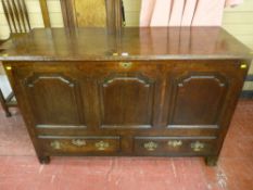 A well patinated 18th Century oak Lancashire style dower chest having three front shaped and fielded