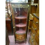 A reproduction French style Kingwood and brass embellished corner cabinet with tulip wood inlay to