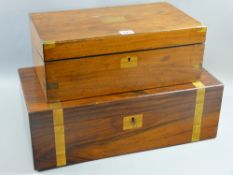 A Victorian walnut writing slope with brass corners, 15 x 40 cms and a larger walnut example with