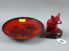 A Royal Doulton flambé seated fox, 11 cms high (restored) and a Royal Doulton shallow dish with