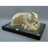 A Studio pottery cubist style model of a cat with her kittens recumbent on a black painted plinth