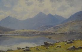 WARREN WILLIAMS ARCA watercolour - Snowdonia lake with boat, signed, 33 x 50cms (faded)