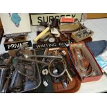 A quantity of loose doctor's surgery examination instruments, sundry surgery door signs and