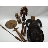 A parcel of exotic native carved figures and masks etc