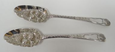 A pair of George III silver berry-spoons having incise decoration and raised fruit to the bowls,