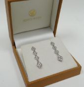 A pair of 18ct white gold multi-diamond link-drop earrings
