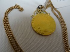 A George IV Spade Guinea 1790, attached to a modern 9ct yellow gold necklace, total weight 14.45gms