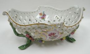 A twentieth century Meissen lattice work basket with raised naturalistic base and with painted