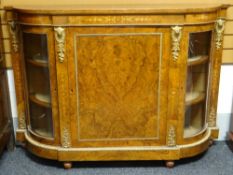A burr-walnut marquetry credenza, having closed centre cabinet flanked by curved glass cabinets