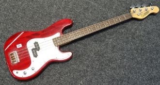 A red-wood effect and mottled white lustre Encore electric guitar