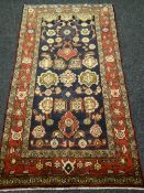 Blue ground hand-woven Persian village rug, 205 x 125 cms