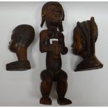 A carved native Fang-tribe style seated figure and a pair of African carved native busts