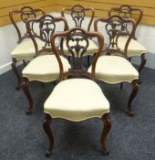 Set of six mahogany drawing room chairs having carved and shaped backs and with yellow upholstered