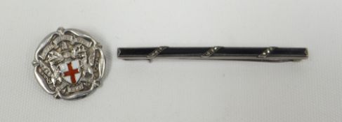 A white metal bar brooch and a silver enamelled crest brooch for UNITED WARDS CLUB