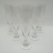 A set of six Lalique champagne-flutes with twisted-knop stems, 18cms