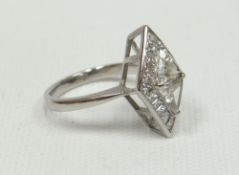 An 18ct white gold diamond ring with two centre triangle-diamonds (colour estimated as J) surrounded