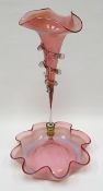 A cranberry glass epergne, the base of frilled form and with single centre vase, 38cms high