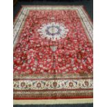 Red ground Kashmir carpet, floral medallion design, 380 x 280 cms