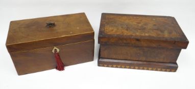 A Georgian mahogany tea-caddy with box-stringing borders, the hinged lid revealing three lidded